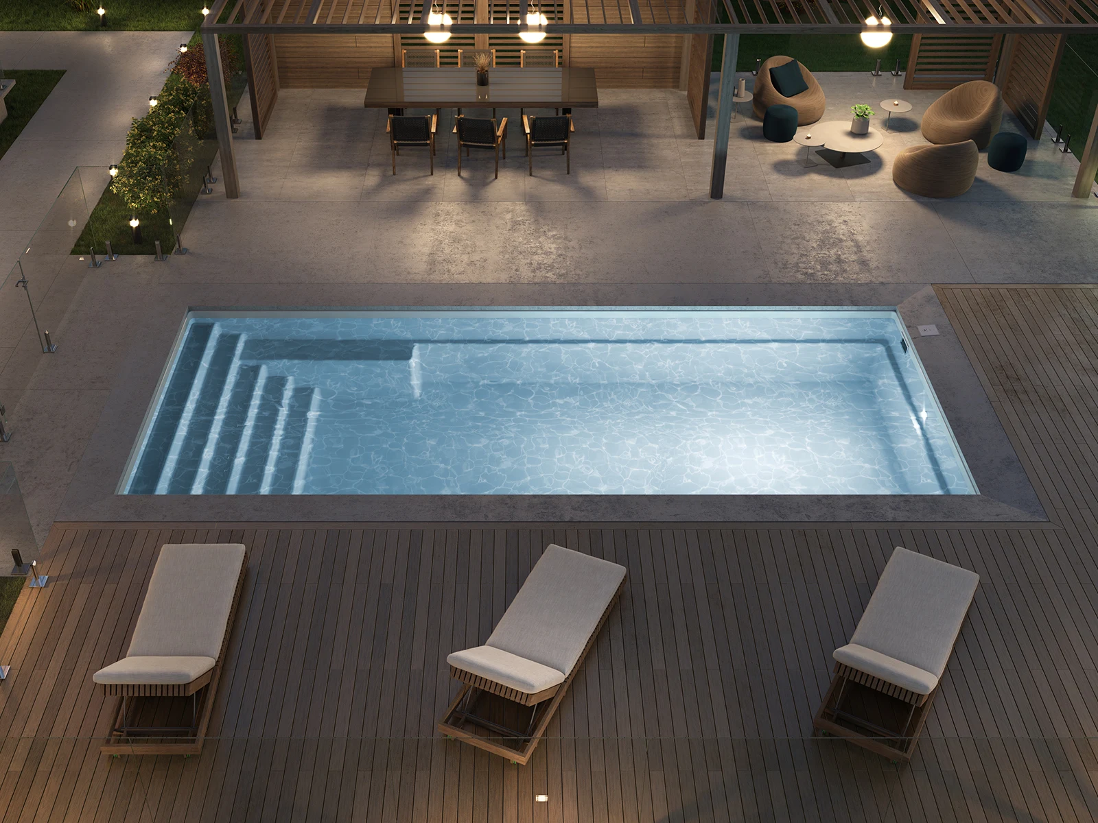 Piscine creusée en fibre de verre Mova, modèle 12x28, finition Diamant couleur Mova, ambiance soirée éclairée