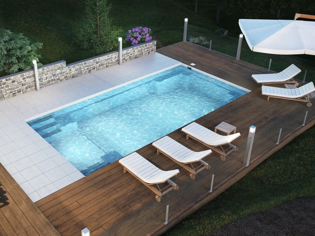 Piscine creusée en fibre de verre Mova, modèle 14x28 - Pente, finition Diamant couleur Mova, ambiance soirée éclairée