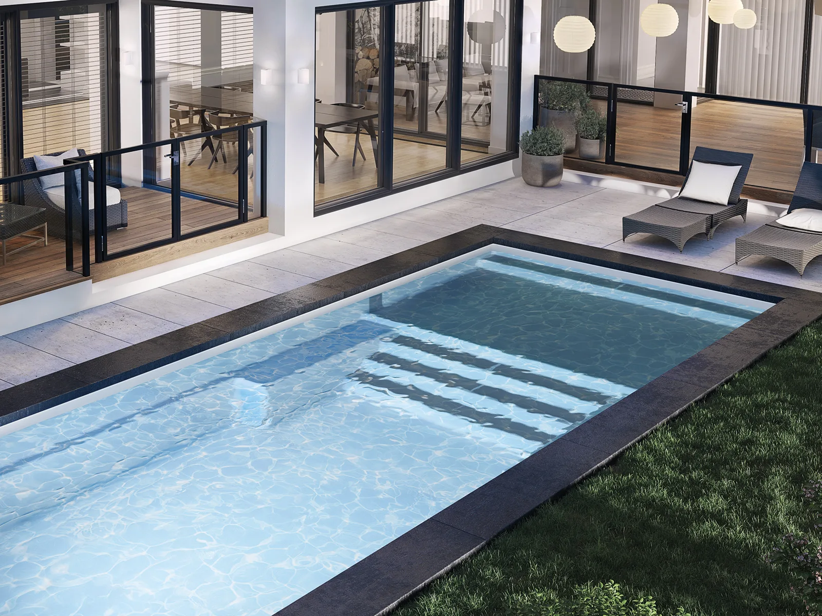 Piscine creusée en fibre de verre Mova, modèle 12x25 - Avec terrasse, finition Diamant couleur Mova, ambiance soirée éclairée